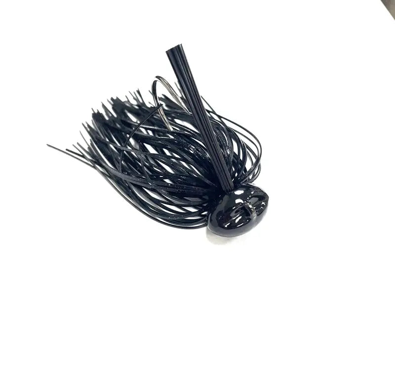 A black plastic fishing jig lure with a ribbed head and skirt, shown on a plain white background.