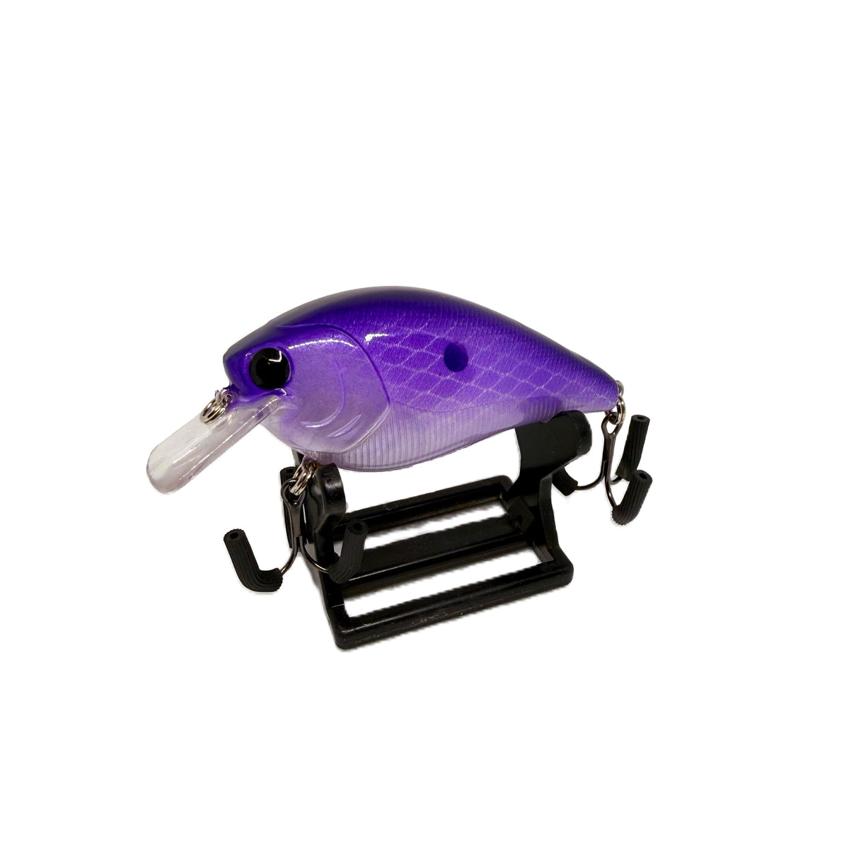 A purple and silver gradient hard bait fishing lure with a clear plastic lip, displayed on a black stand against a white background.