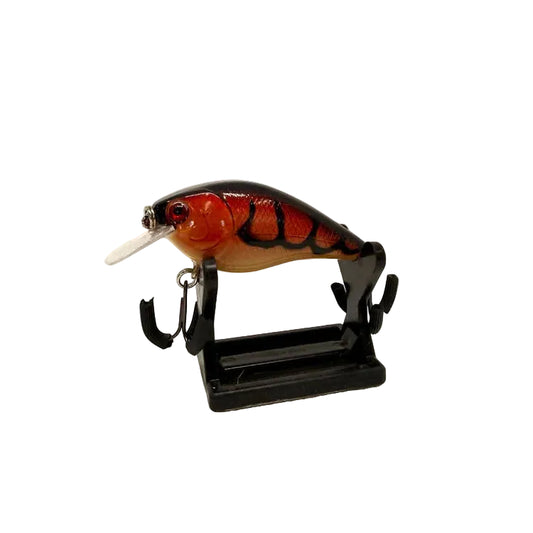 A fishing lure with a realistic fish design, featuring a red and orange body with black stripes, a clear diving bill, and a black mounting stand, photographed against a plain white background.